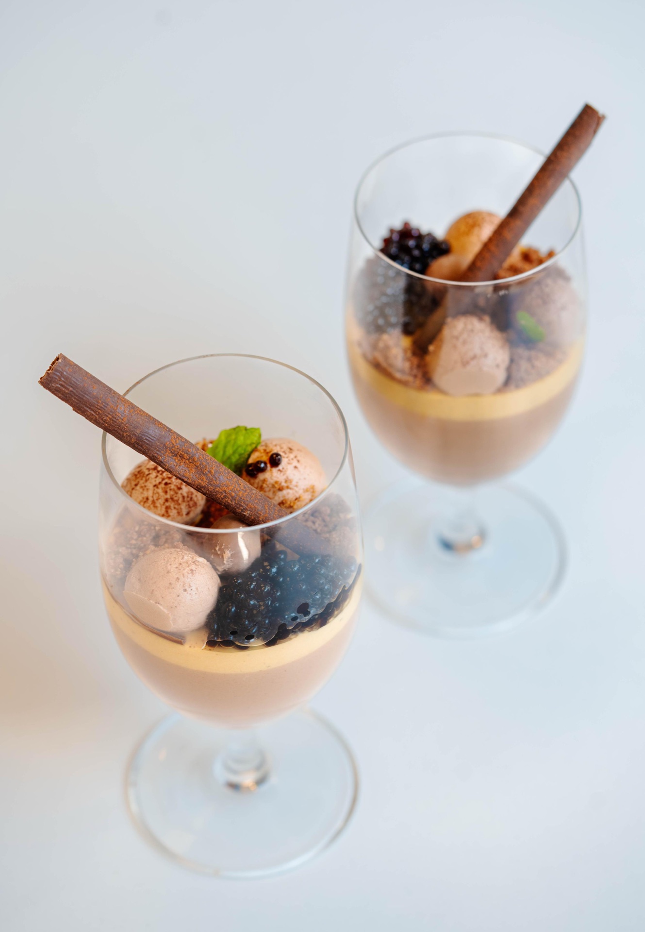 Chef delicately plating culinary creation with precision
